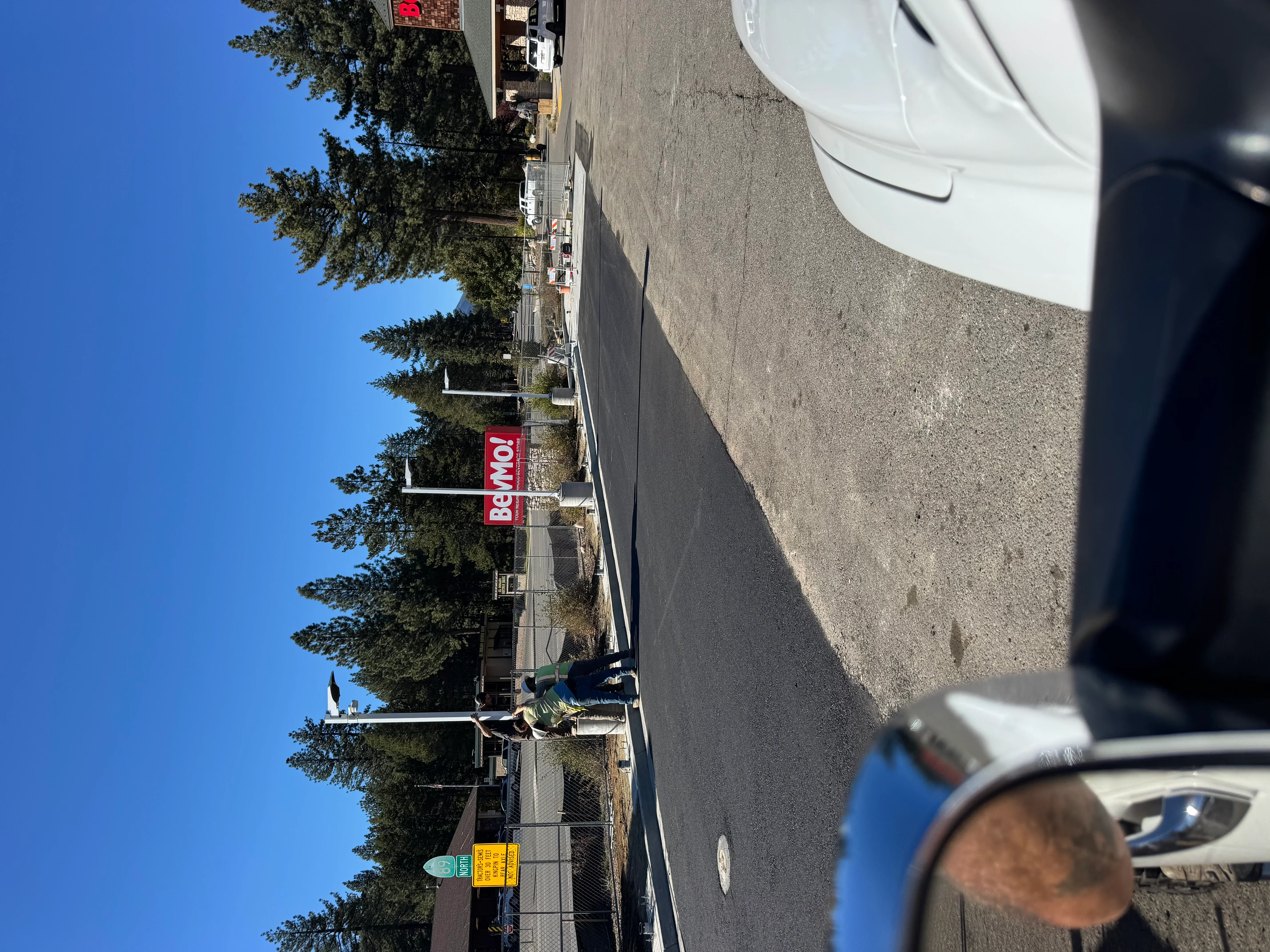 Newly paved commercial asphalt lot with clear markings and professional finish